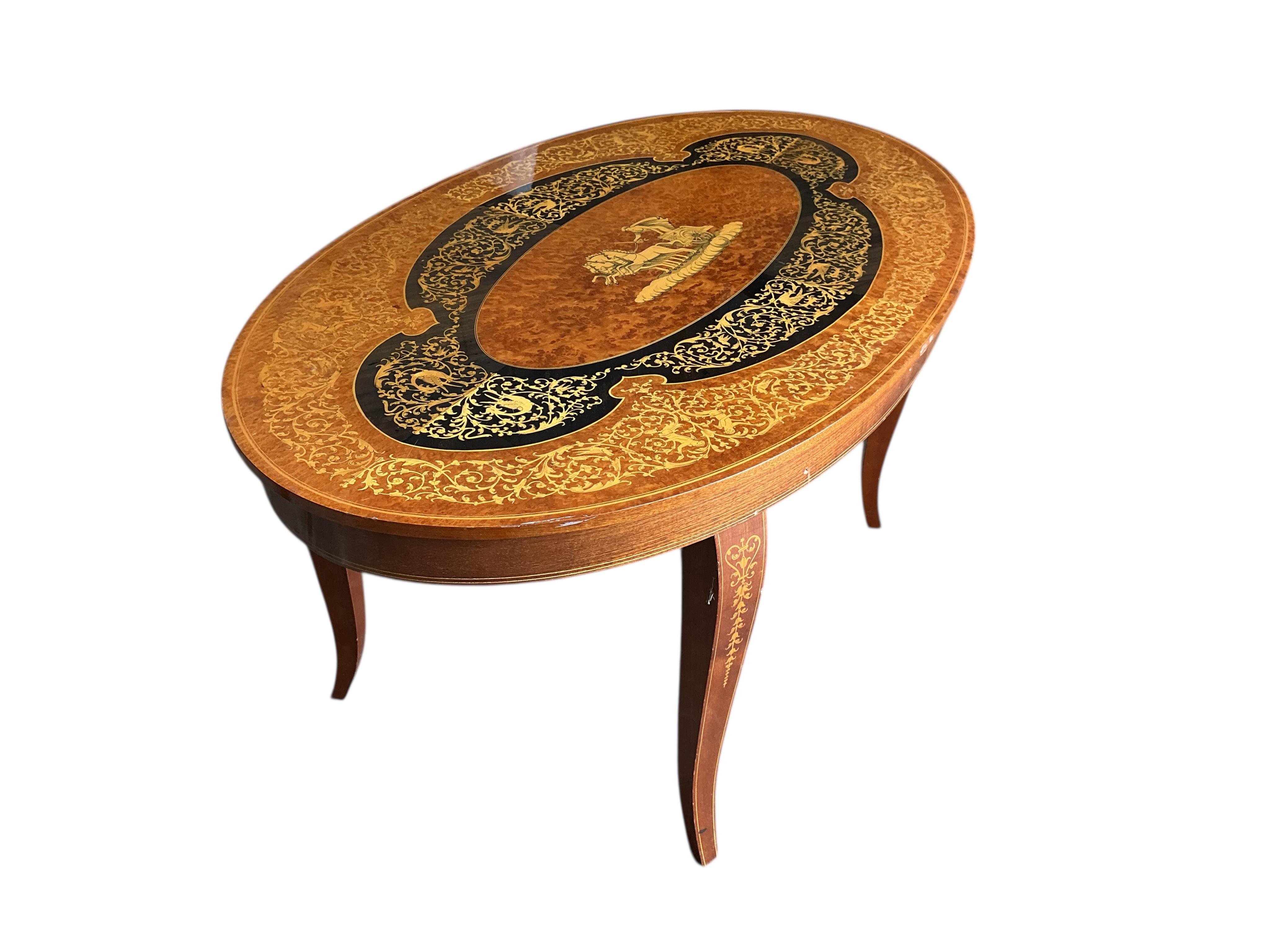 A Sorrento marquetry oval bird's eye maple coffee table, width 99cm, depth 58cm, height 47cm